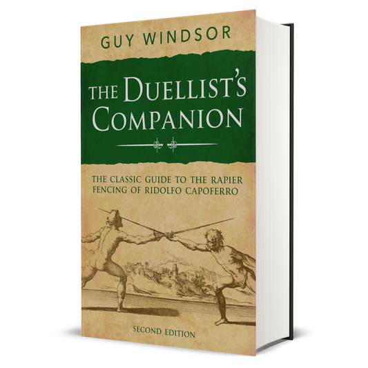 The Duellist's Companion book by Guy Windsor, Second Edition, shown as a 3D mockup on a white background. The cover features a dark green top section with white lettering and a beige lower section with a sepia sketch of two duelists.